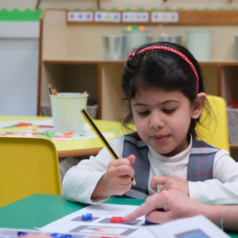 girl using a pencil